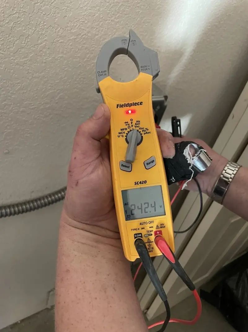 Voltage testing with clamp meter during Outlet Installation in Dundee